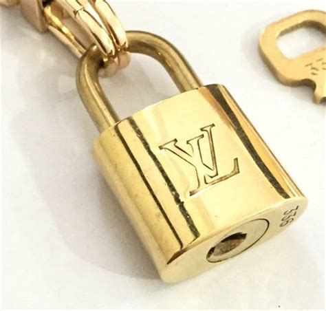 louis vuitton gold padlock|Louis Vuitton lock 3220.